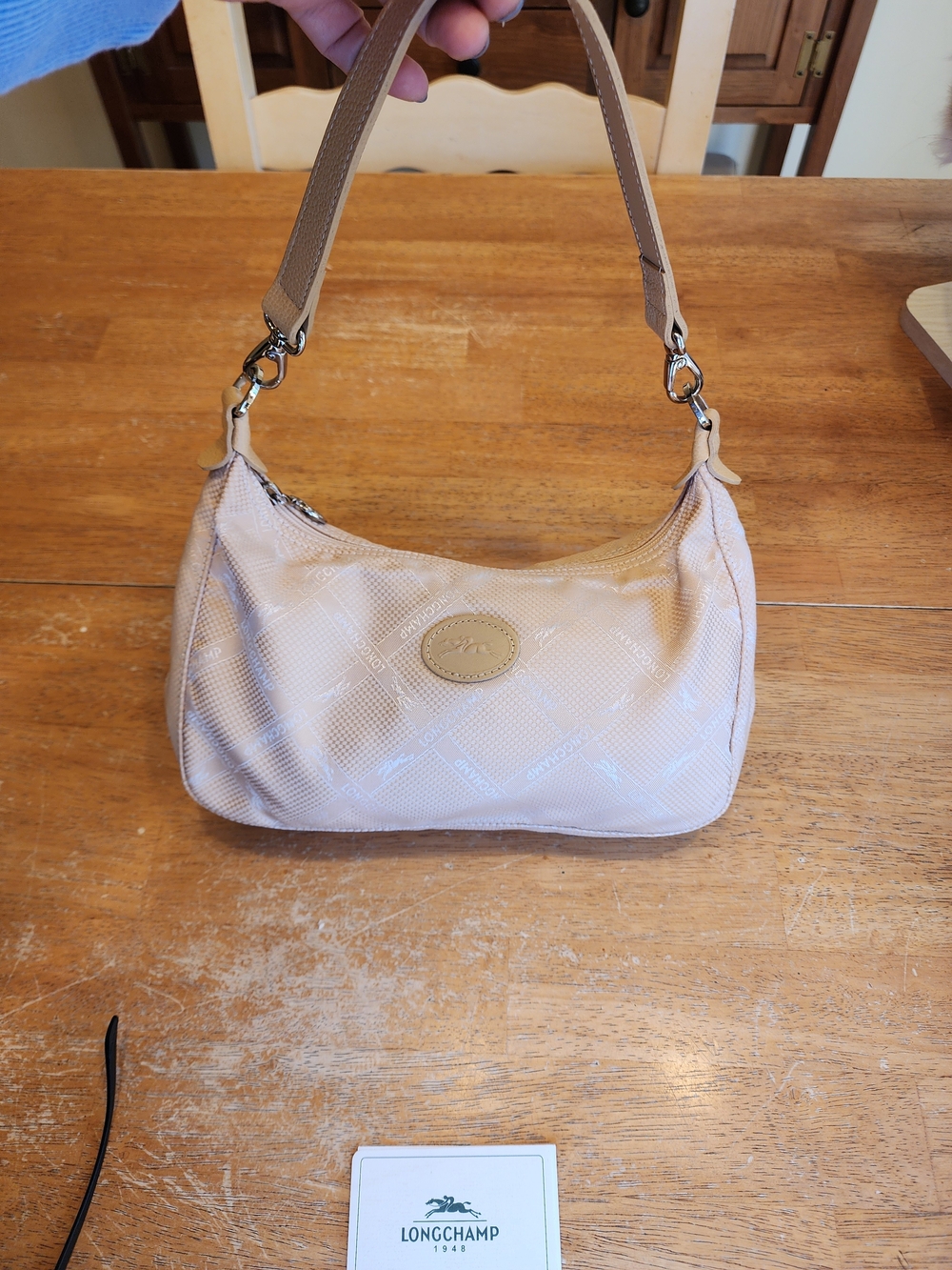 beige nylon Longchamp hobo shoulder bag with a monogram print and leather trim.